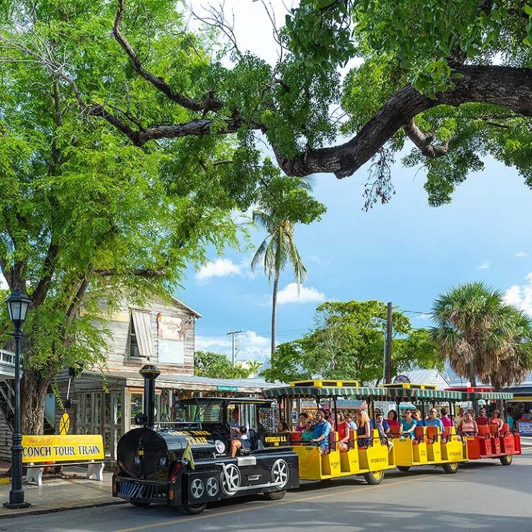 conch tour train driving past mallory square