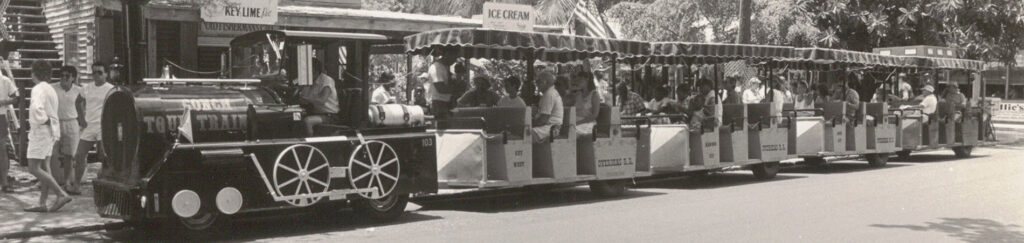 Historic black and white photo of the original Conch Tour Train from 1958 next to a modern color photo.